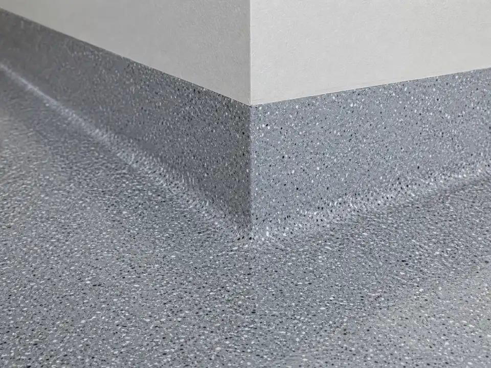 Decorative flake coating extended up a Marietta garage stem wall