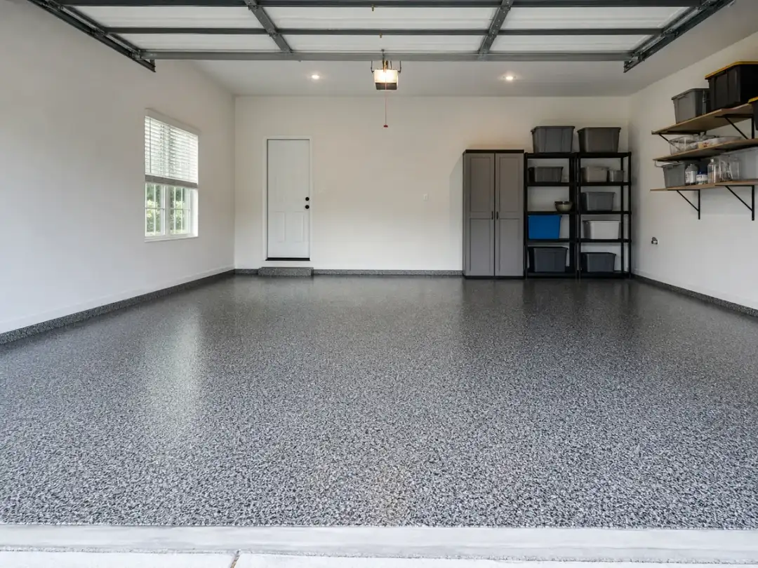 Gray-and-black decorative flake coating across a residential Atlanta garage floor