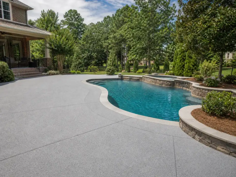 Textured concrete coating surrounding a pool deck in Suwanee